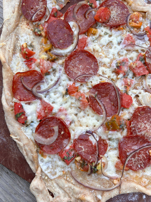 close up image of homemade pizza with uncured pepperoni